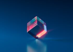 A vibrant and futuristic 3D cube with glowing edges on a dark blue background.